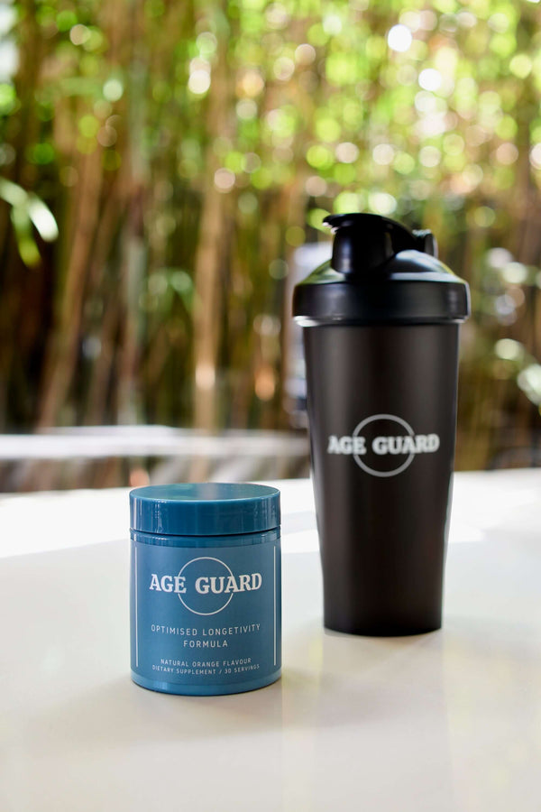 A container of Age Guard all-in-one longevity formula with NMN and collagen, shown next to the black shaker bottle included with first-time orders.