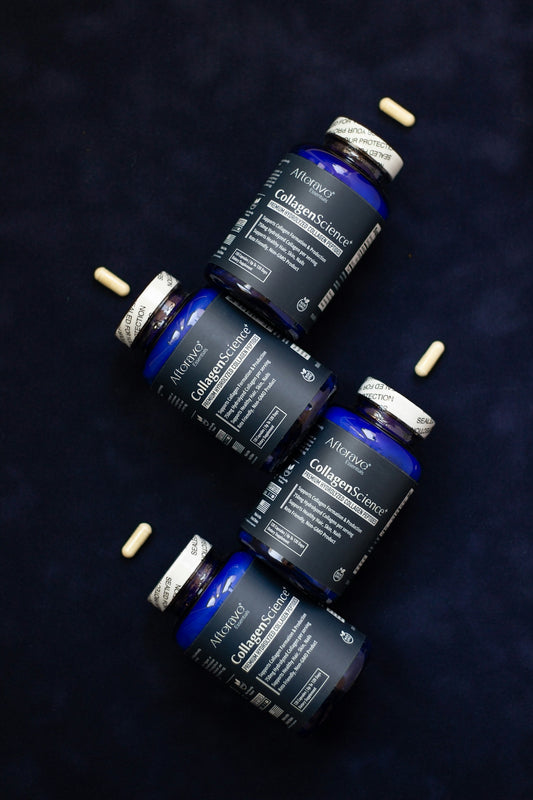 Three bottles of vitamins sitting next to each other